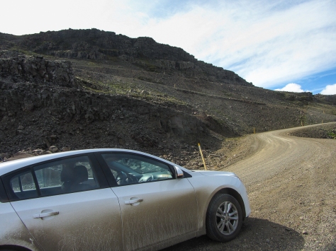 Still on Route 1. Note the gravel road and the gradient coming up. Hire cars looking a bit dirty!